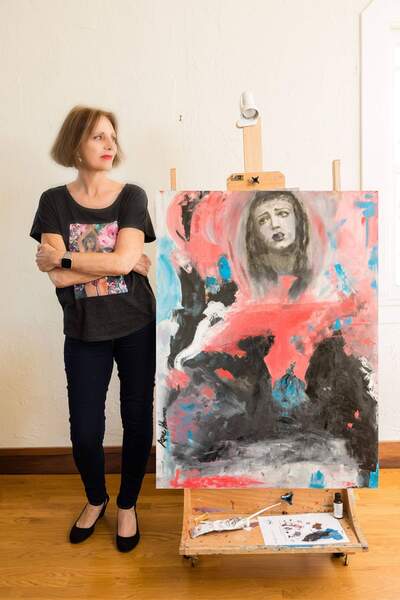 ane howard artist in front of painting Medusa